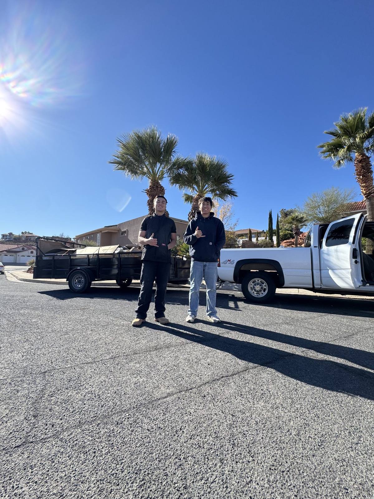 Noah and Kai of Grizzly Junk Solutions with their truck and trailer, ready for a job